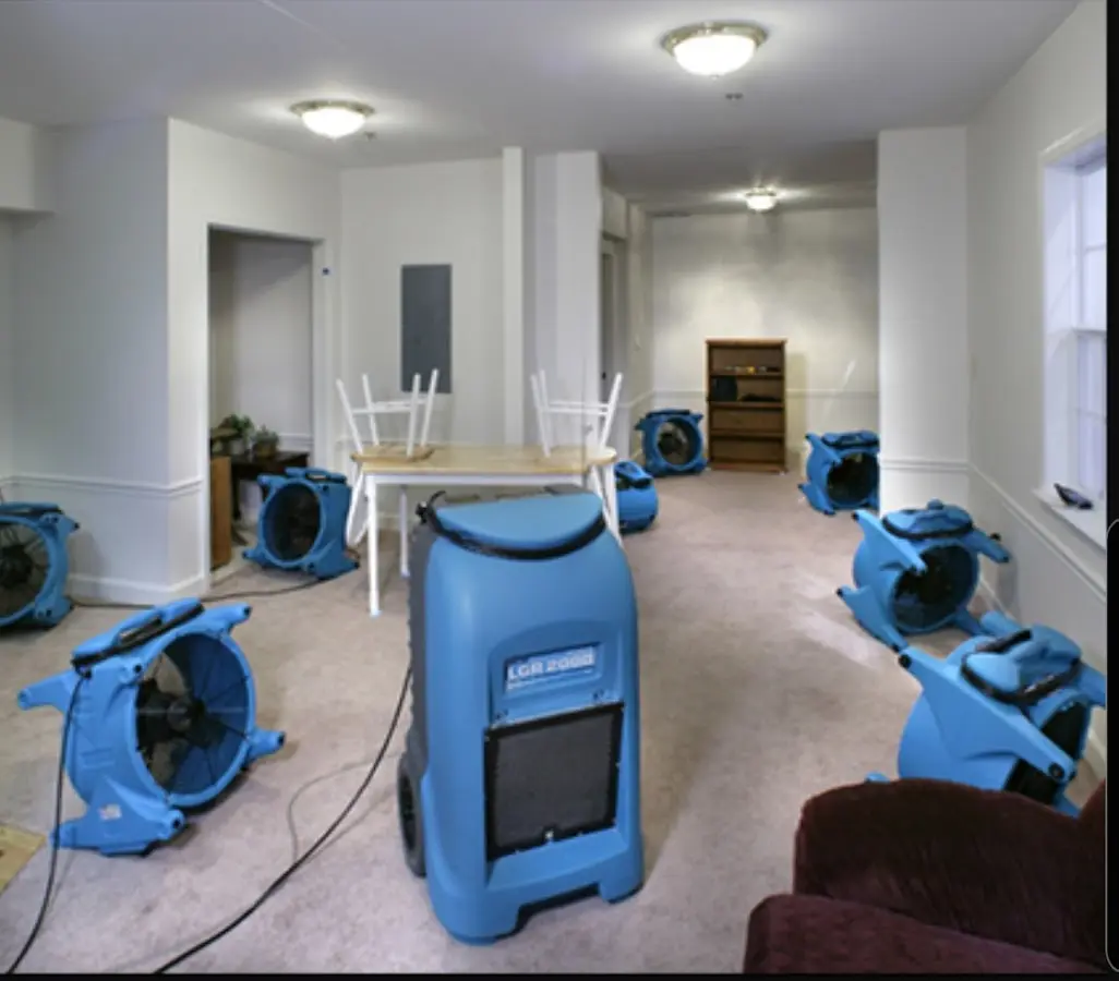 Air movers and dehumidifier setup for Water Damage Restoration in Blaine